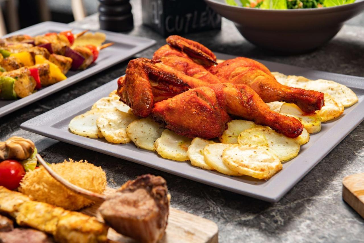 Park Inn by Radisson Makkah Aziziyah Mecca Bagian luar foto A plate of chicken pakora